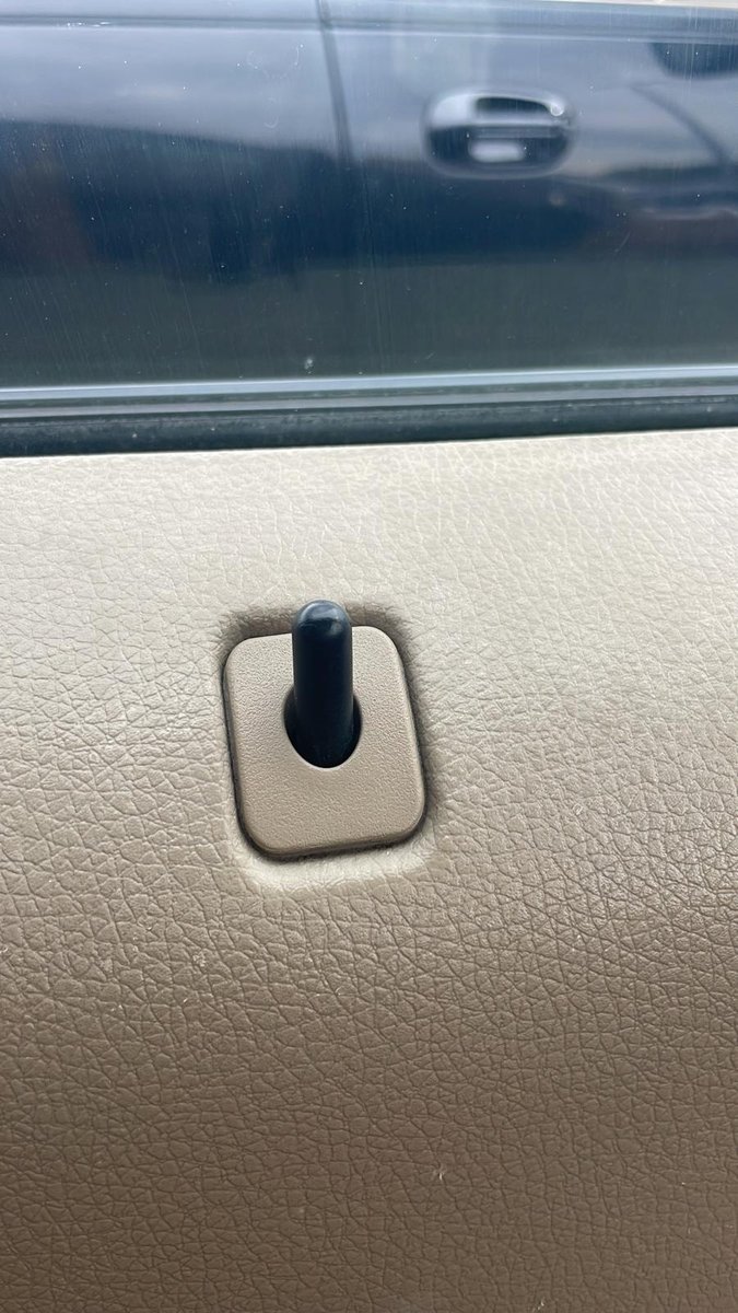 Car door lock pin popped up after unlocking