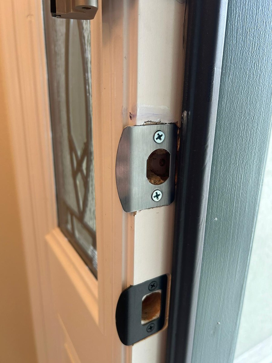 Fresh deadbolt and latch installation on a front door