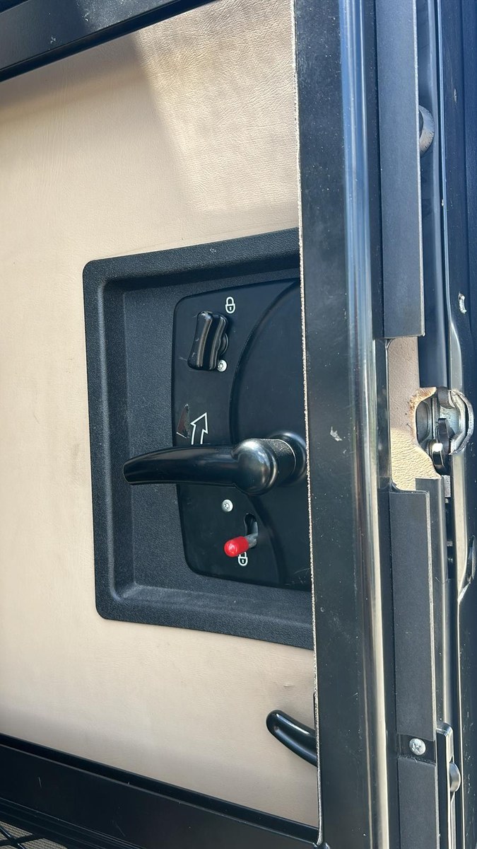 RV entry door latch mechanism during repair