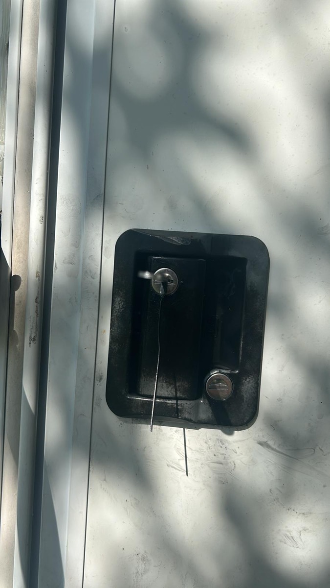 RV trailer paddle latch after lockout service