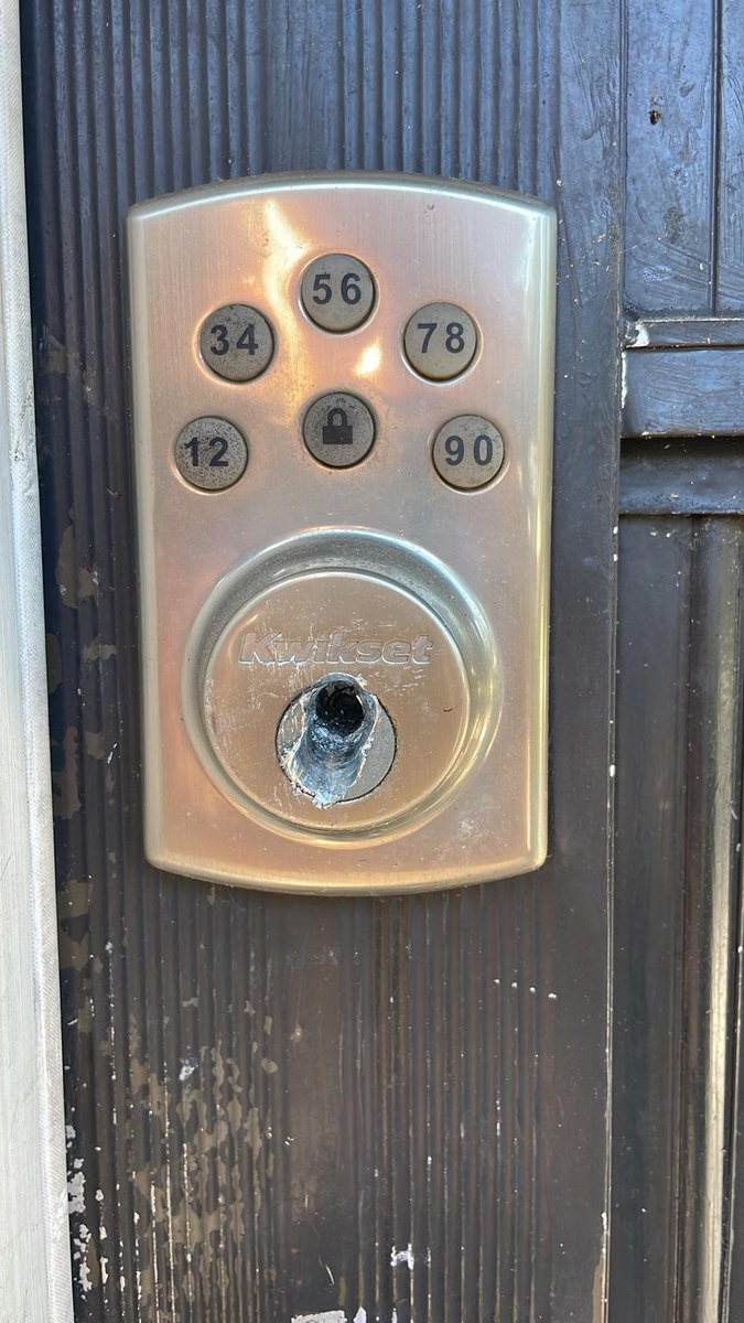Keypad deadbolt on a dark wood front door