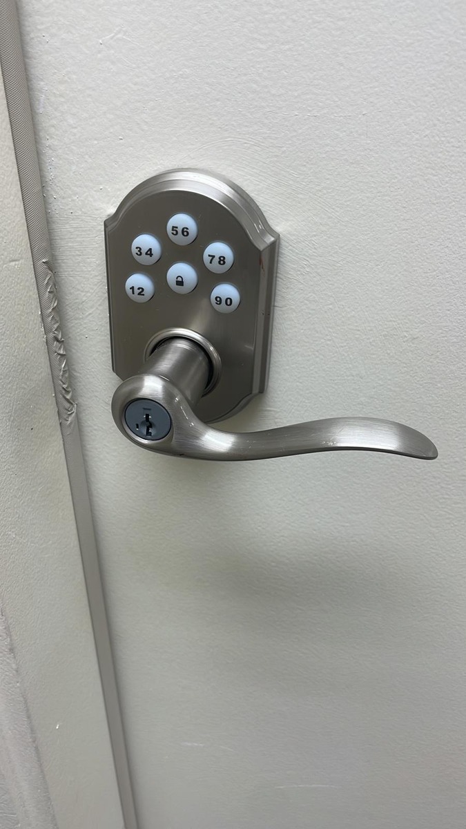 Kwikset SmartCode keypad lever on a white door